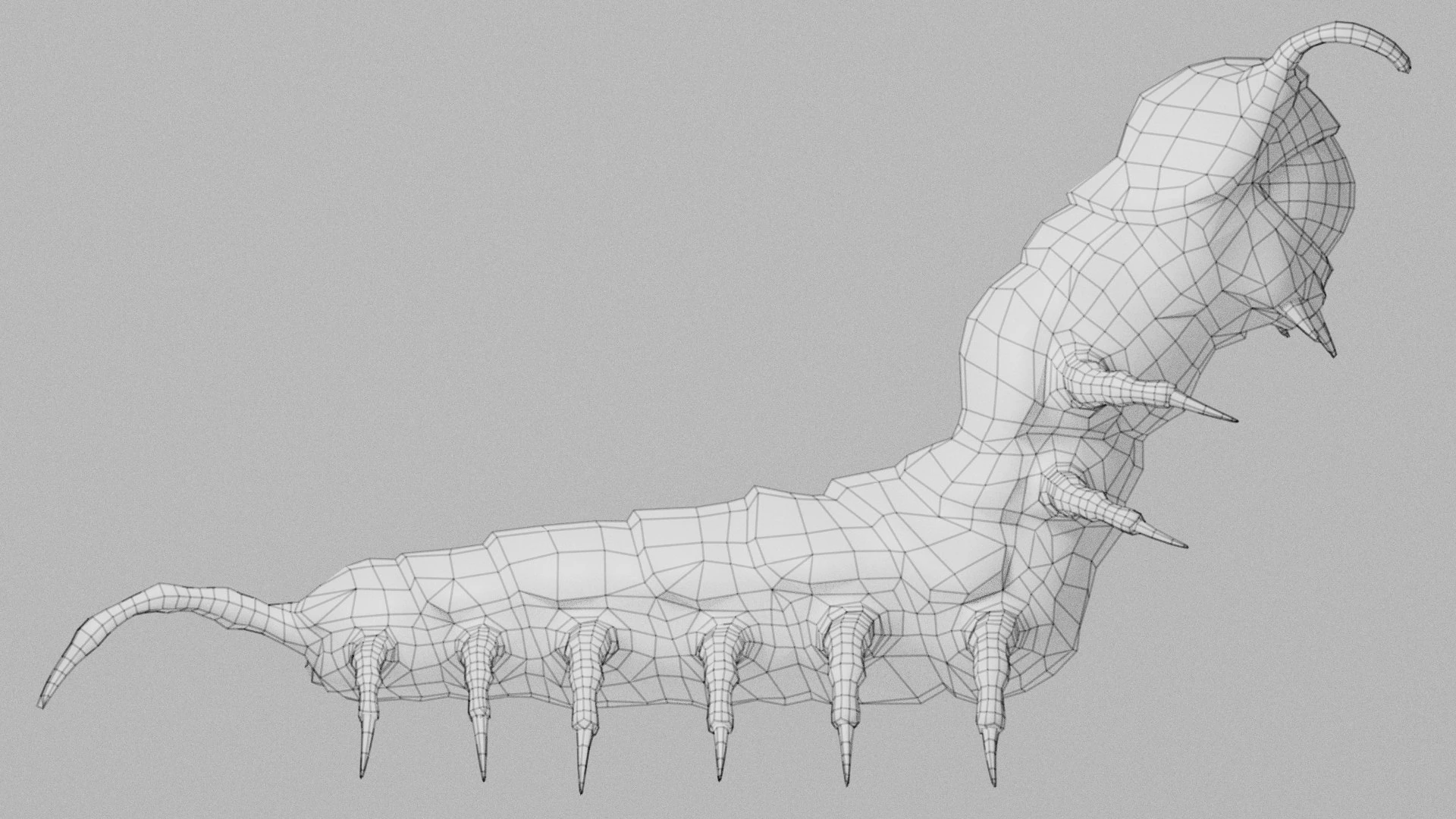 Side wireframe render of the Oculon eyeball centipede monster showing clean topology and polygon flow