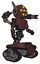 Droid containing round head and yellow eyes array and head winglets and light chest exoshielding and prototype exoplate chest and minigun back assembly and tank tracks. Steampunk copper.