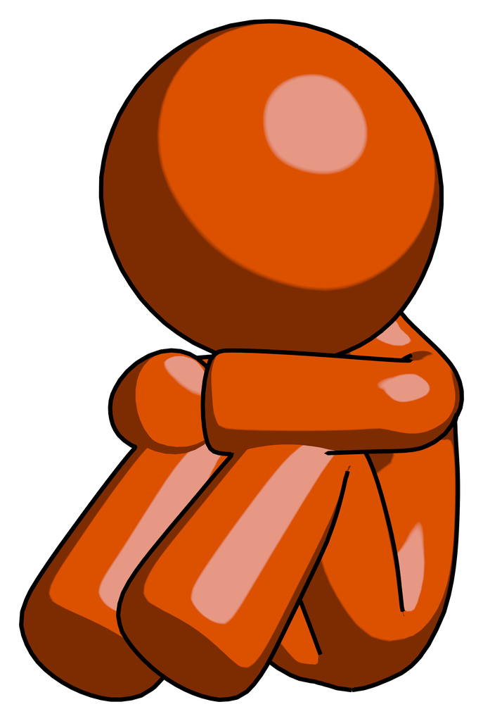 Orange Design Mascot Man Sitting with Head Down Facing Angle Left