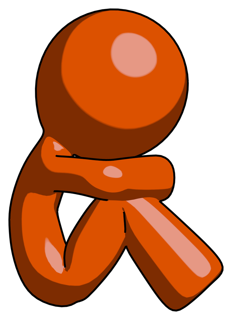 Orange Design Mascot Man Sitting with Head Down Facing Sideways Right