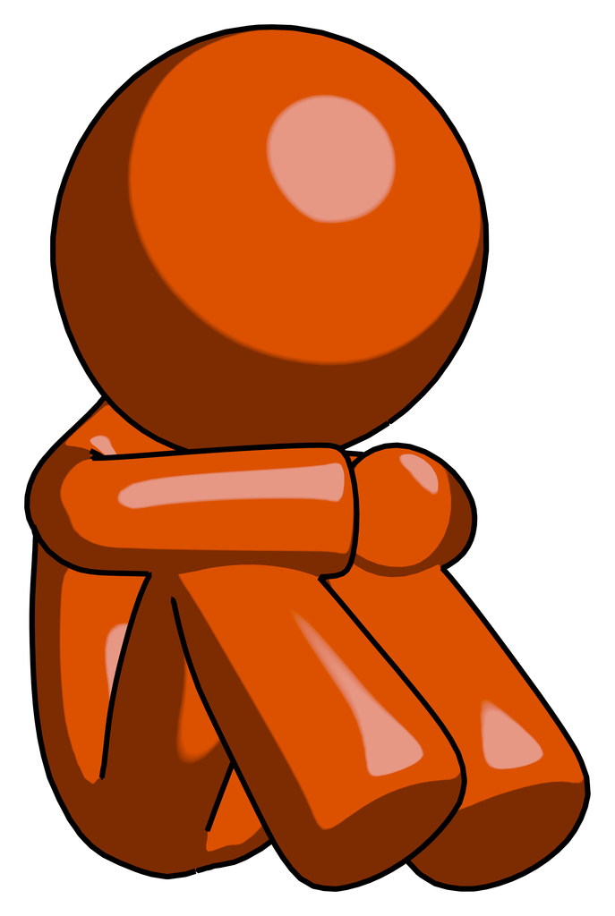 Orange Design Mascot Man Sitting with Head Down Facing Angle Right