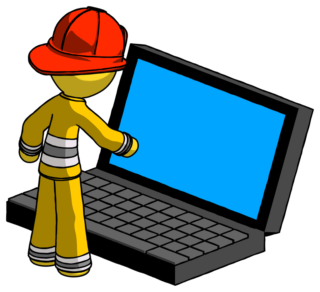 Yellow Firefighter Fireman Man using large laptop computer