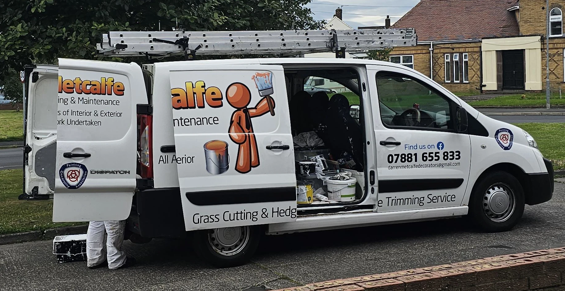 Orange Man painter mascot printed on a Metcalfe Painting & Maintenance van in the UK.